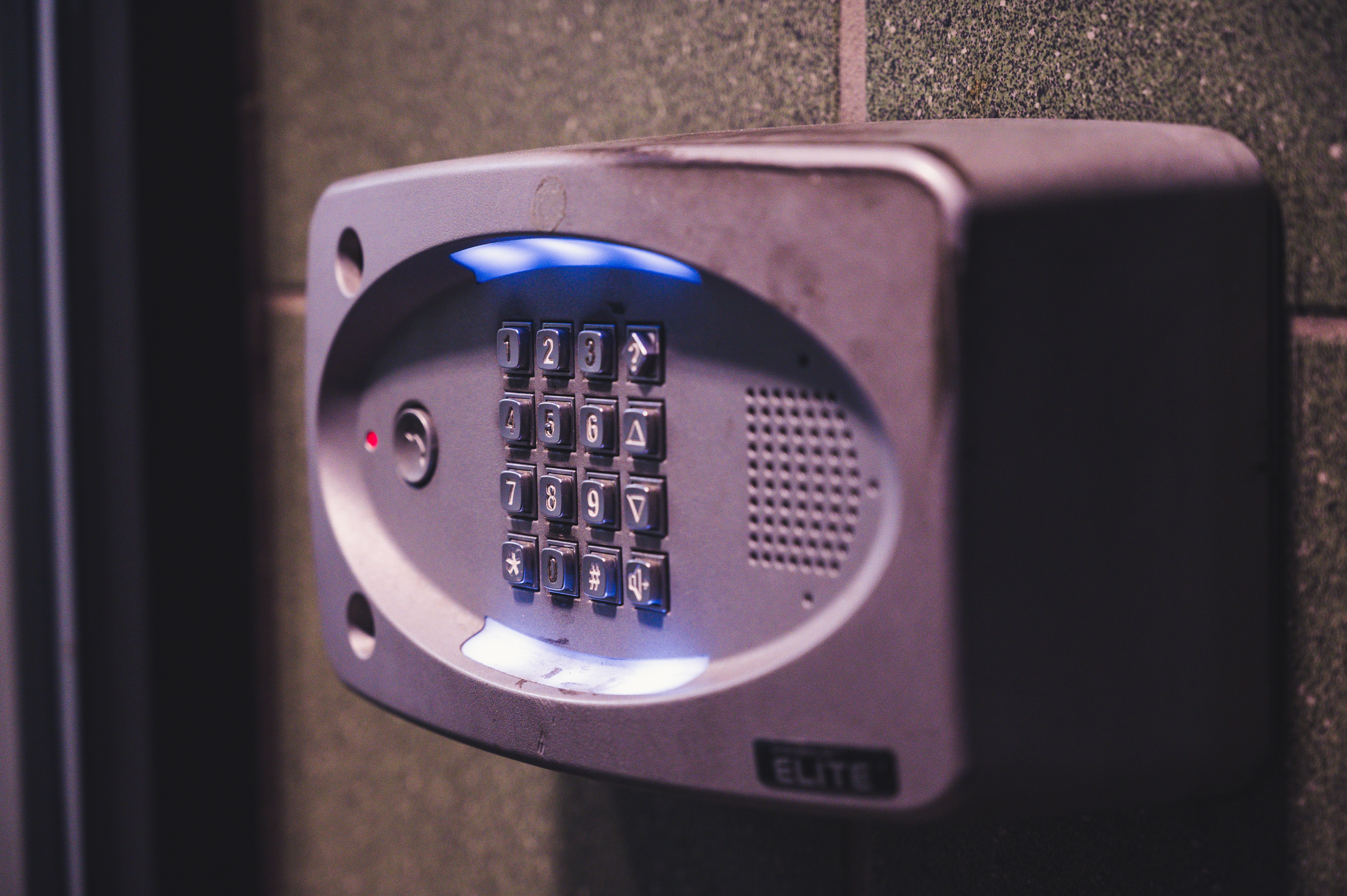Illuminated security keypad mounted on an interior wall